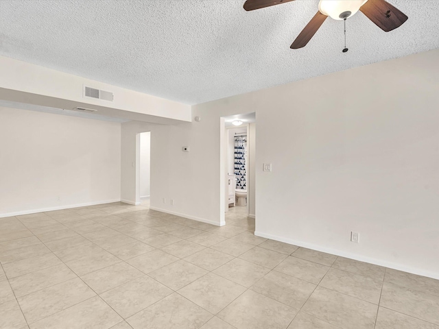 614 NW 13th St Unit 27, Boca Raton, FL 33486 - empty room featuring visible vents, a textured ceiling, ceiling fan, and light tile patterned flooring