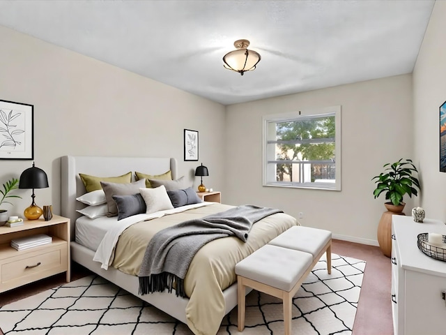 614 NW 13th St Unit 27, Boca Raton, FL 33486 - bedroom featuring baseboards and light carpet