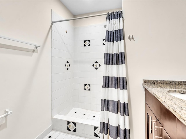 614 NW 13th St Unit 27, Boca Raton, FL 33486 - full bath featuring vanity, baseboards, tile patterned flooring, and tiled shower