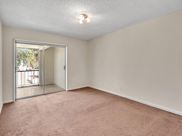 614 NW 13th St Unit 27, Boca Raton, FL 33486 - carpeted spare room featuring a textured ceiling and baseboards