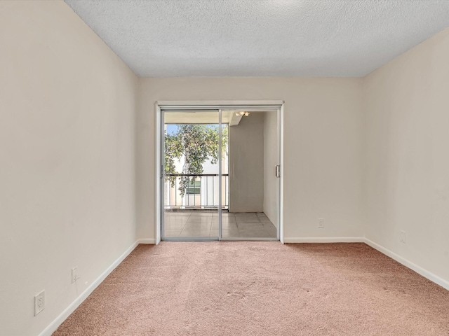 614 NW 13th St Unit 27, Boca Raton, FL 33486 - empty room featuring baseboards, carpet, and a textured ceiling