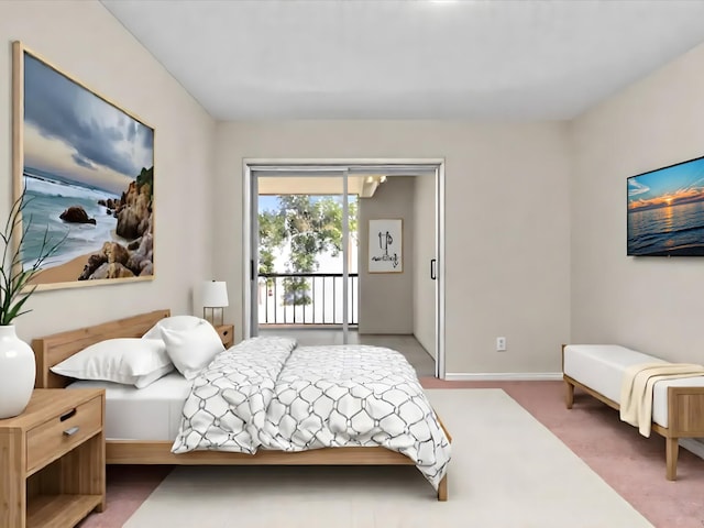 614 NW 13th St Unit 27, Boca Raton, FL 33486 - bedroom with baseboards and access to exterior