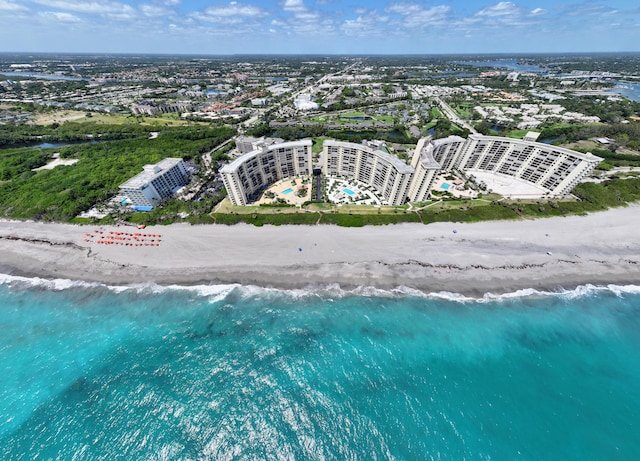 bird's eye view featuring a beach view and a water view