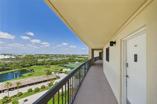 balcony featuring a water view