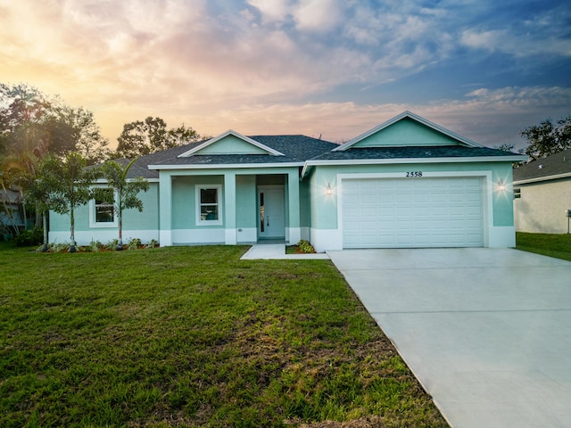 ranch-style house with stucco siding, a garage, roof with shingles, a front lawn, and concrete driveway