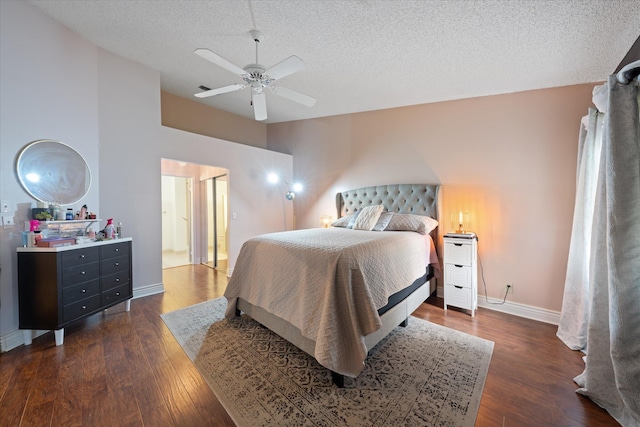 bedroom with baseboards, ceiling fan, a textured ceiling, and dark wood-style flooring