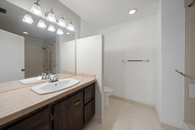 bathroom with a tile shower, tile patterned flooring, toilet, vanity, and visible vents