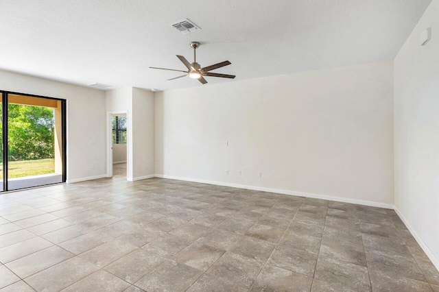 6056 NW Regent St, Port Saint Lucie, FL 34983 - unfurnished room with visible vents, baseboards, and ceiling fan