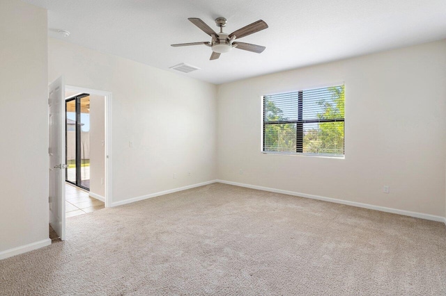 6056 NW Regent St, Port Saint Lucie, FL 34983 - spare room featuring carpet flooring, a ceiling fan, baseboards, and visible vents