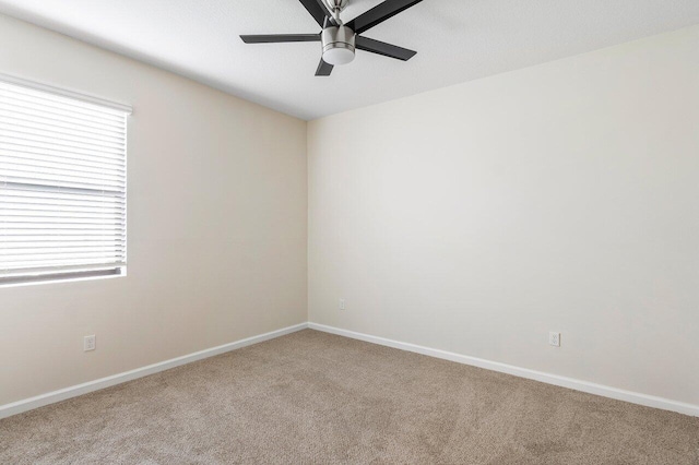 6056 NW Regent St, Port Saint Lucie, FL 34983 - carpeted spare room with baseboards and ceiling fan