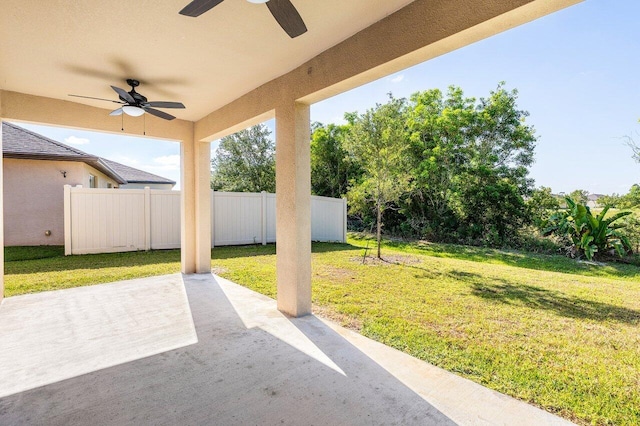 6056 NW Regent St, Port Saint Lucie, FL 34983 - view of patio / terrace featuring a ceiling fan and fence