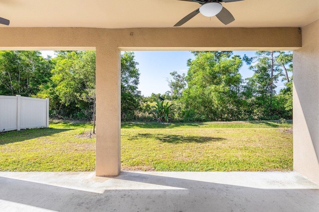 6056 NW Regent St, Port Saint Lucie, FL 34983 - view of yard with a patio, a ceiling fan, and fence