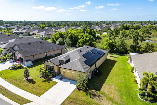 6056 NW Regent St, Port Saint Lucie, FL 34983 - birds eye view of property with a residential view