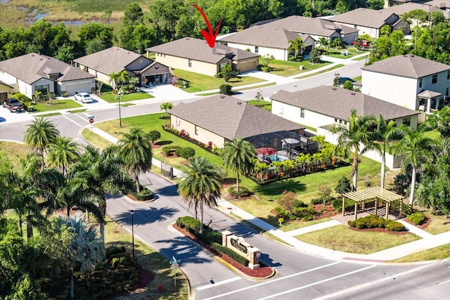 6056 NW Regent St, Port Saint Lucie, FL 34983 - birds eye view of property with a residential view