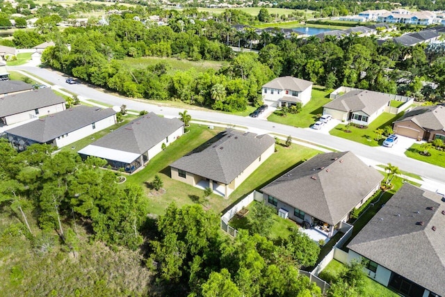 6056 NW Regent St, Port Saint Lucie, FL 34983 - bird's eye view with a water view and a residential view