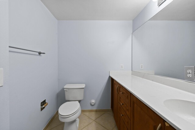 6565 Emerald Dunes Dr Unit 108, West Palm Beach, FL 33411 - bathroom featuring tile patterned flooring, baseboards, toilet, and vanity