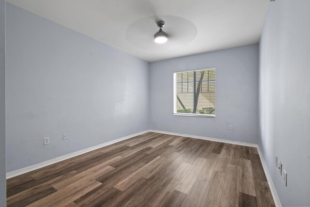 6565 Emerald Dunes Dr Unit 108, West Palm Beach, FL 33411 - empty room with baseboards, ceiling fan, and dark wood-style floors