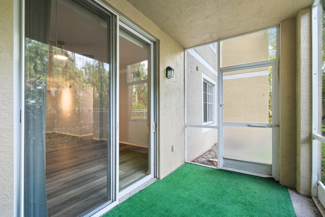 6565 Emerald Dunes Dr Unit 108, West Palm Beach, FL 33411 - unfurnished sunroom with plenty of natural light
