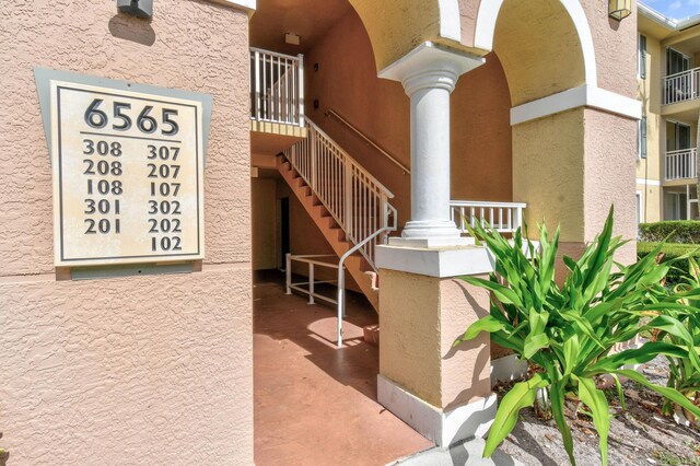 6565 Emerald Dunes Dr Unit 108, West Palm Beach, FL 33411 - spare room with crown molding, baseboards, ceiling fan, and wood finished floors