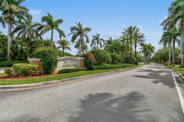 6565 Emerald Dunes Dr Unit 108, West Palm Beach, FL 33411 - view of road featuring curbs and traffic signs