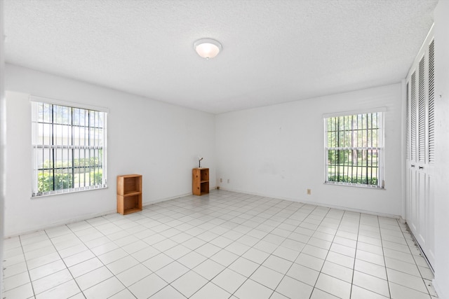 208 Cape Cod Cir, Lake Worth, FL 33467 - unfurnished room with plenty of natural light and a textured ceiling