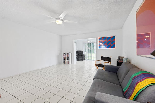 208 Cape Cod Cir, Lake Worth, FL 33467 - living room featuring a textured ceiling, a ceiling fan, and light tile patterned flooring