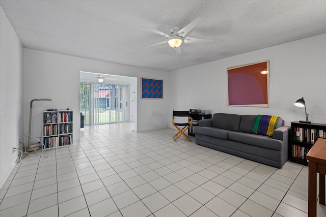 208 Cape Cod Cir, Lake Worth, FL 33467 - living area featuring a ceiling fan, a textured ceiling, and light tile patterned floors