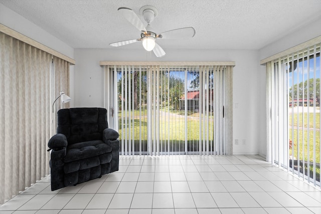 208 Cape Cod Cir, Lake Worth, FL 33467 - living area featuring plenty of natural light, a textured ceiling, light tile patterned floors, and ceiling fan