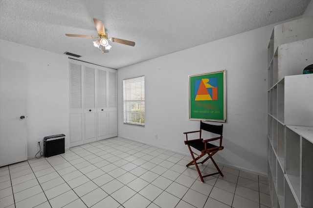 208 Cape Cod Cir, Lake Worth, FL 33467 - unfurnished room featuring a textured ceiling, a ceiling fan, and light tile patterned floors