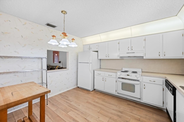 208 Cape Cod Cir, Lake Worth, FL 33467 - kitchen featuring wallpapered walls, white appliances, under cabinet range hood, light countertops, and a textured ceiling