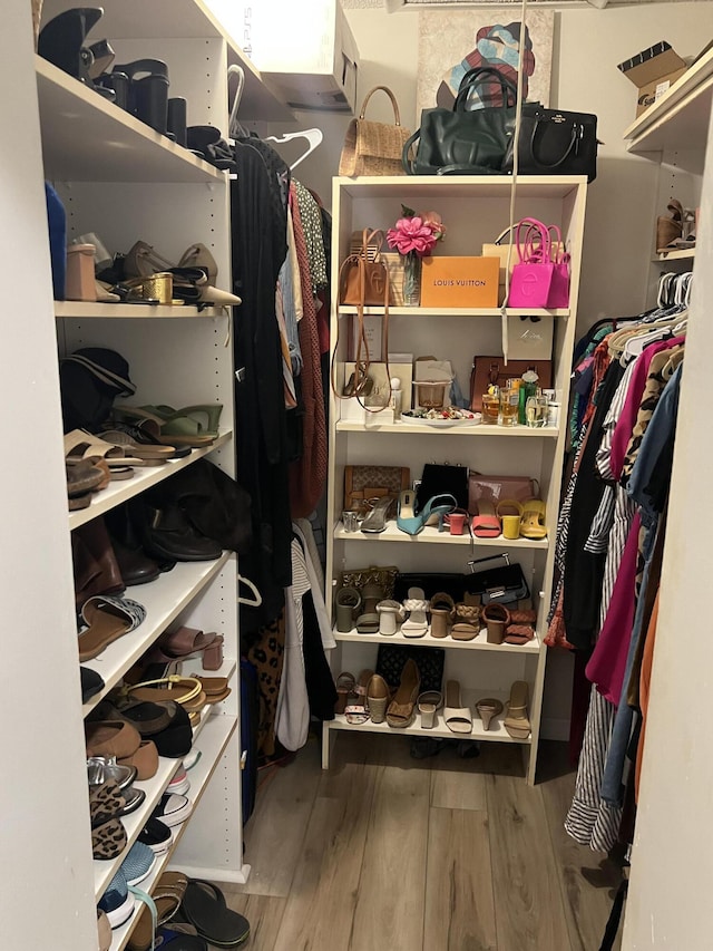 spacious closet with wood finished floors