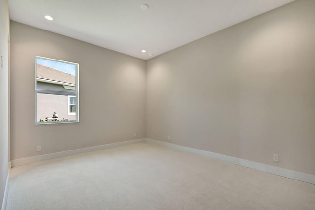 spare room with baseboards, carpet flooring, and recessed lighting