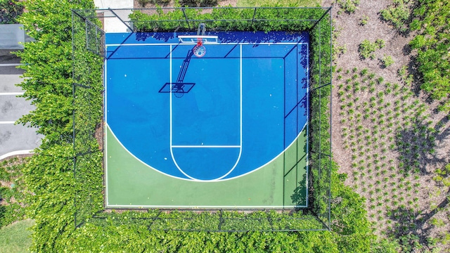 view of basketball court with fence