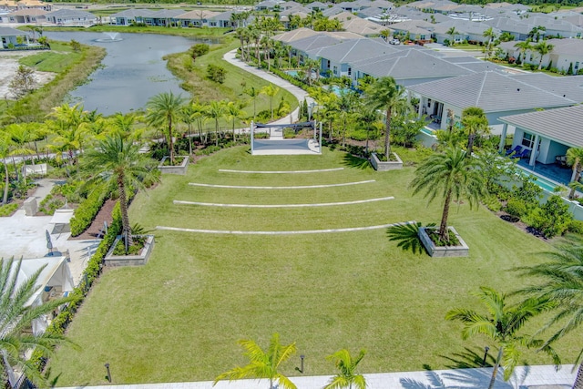 birds eye view of property with a residential view and a water view