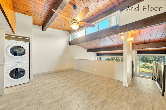 laundry area featuring a wealth of natural light, laundry area, stacked washer / dryer, and wood ceiling