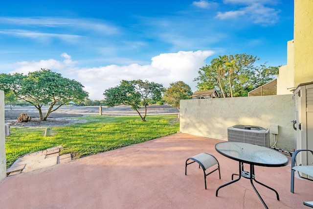 view of patio with fence and central AC