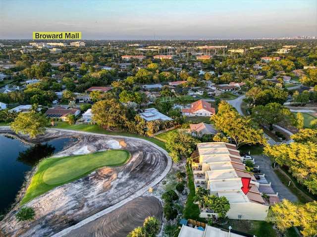 birds eye view of property with a water view and a residential view