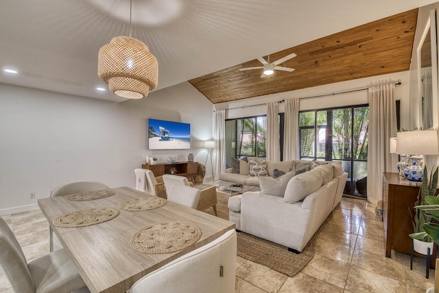 living room with lofted ceiling and baseboards