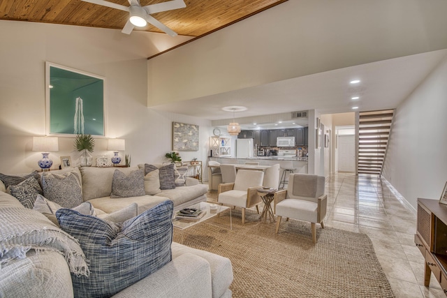 living area featuring a ceiling fan, recessed lighting, and high vaulted ceiling