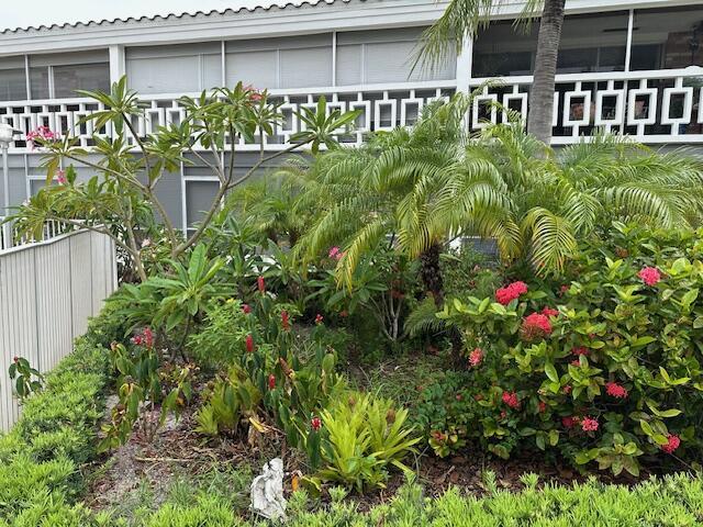 331 Tequesta Dr Unit 212, Tequesta, FL 33469 - view of yard featuring a sunroom