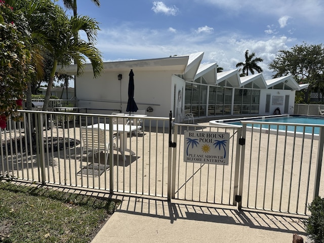 331 Tequesta Dr Unit 212, Tequesta, FL 33469 - view of swimming pool with a gate and a patio area