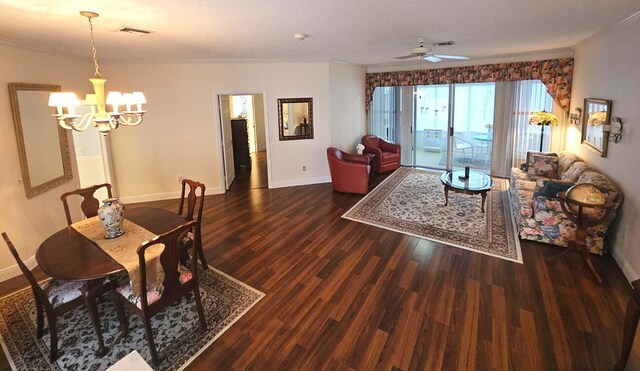 dining space with wood finished floors, visible vents, and baseboards