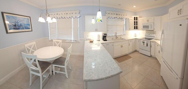 kitchen with white cabinets, white appliances, crown molding, and a sink