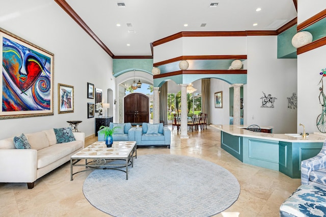 16330 Vintage Oaks Ln, Delray Beach, FL 33484 - living area featuring decorative columns, arched walkways, crown molding, marble tiled flooring, and recessed lighting