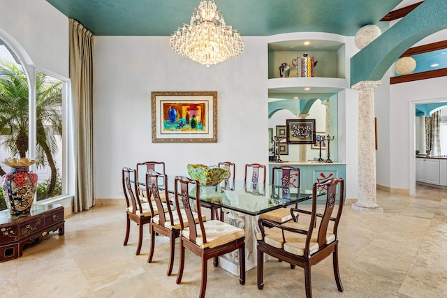 16330 Vintage Oaks Ln, Delray Beach, FL 33484 - dining area featuring arched walkways, plenty of natural light, a chandelier, and a towering ceiling
