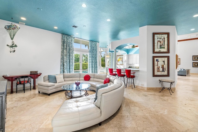 16330 Vintage Oaks Ln, Delray Beach, FL 33484 - living area with recessed lighting, a textured ceiling, baseboards, and arched walkways