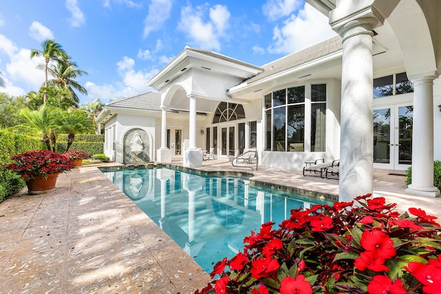 16330 Vintage Oaks Ln, Delray Beach, FL 33484 - view of pool featuring french doors and a patio