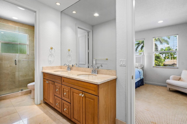 16330 Vintage Oaks Ln, Delray Beach, FL 33484 - ensuite bathroom with double vanity, a stall shower, recessed lighting, toilet, and a textured wall