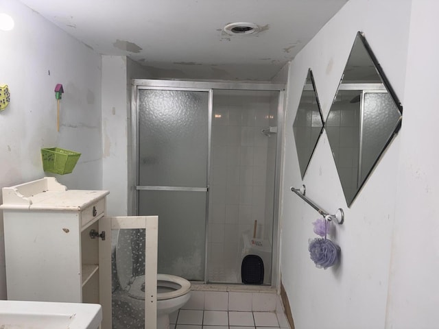 1400 Saint Charles Pl Unit 317, Pembroke Pines, FL 33026 - bathroom featuring tile patterned flooring, a stall shower, and toilet