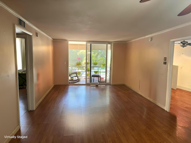 1400 Saint Charles Pl Unit 317, Pembroke Pines, FL 33026 - spare room with a ceiling fan, ornamental molding, wood finished floors, baseboards, and expansive windows